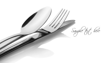 Cutlery - a spoon, fork and knife on a white background