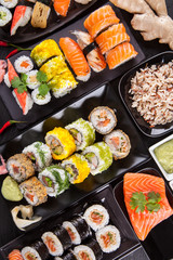 Delicious sushi pieces served on black stone