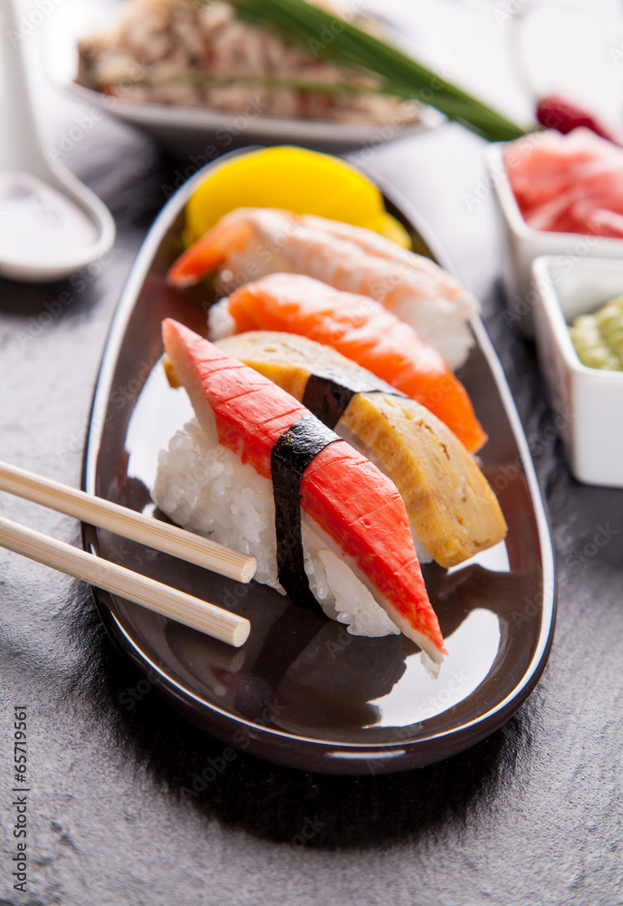 Canvas Prints delicious sushi pieces served on black stone