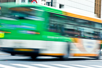 bus speeding with zebra crossing in tokyo on motion