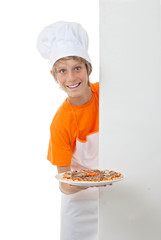 child showing his pizza cooking skills