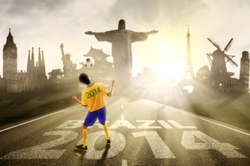 Soccer player heading the ball to brazil