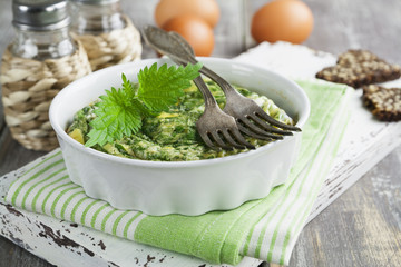 Omelet with nettles in the ceramic pot