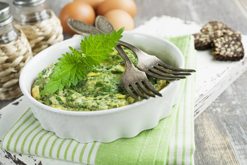 Omelet with nettles in the ceramic pot