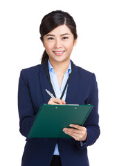 Businesswoman with clipboard