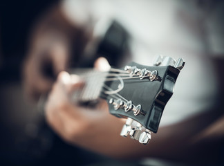 guitar in the hands of the young man