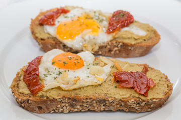 Closeup of Spanish Tapa with Fried egg and dry tomato