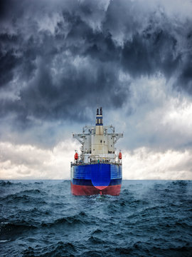 Dark Image Of Big Cargo Ship In Strong Storm.