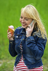 Beautiful girl in city park eating ice cream