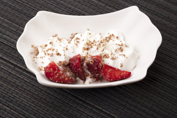 dessert with whipped cream, strawberries and chocolate