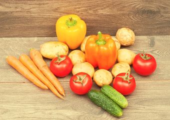 ripe vegetables on a wooden texture