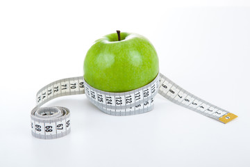 green apple with a ruler