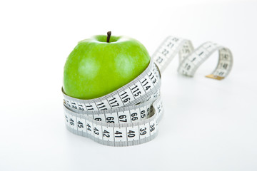 green apple with a ruler