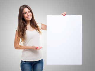 Woman showing a white board