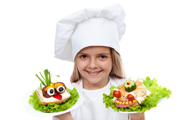 Happy smiling chef kid with creative sanwiches