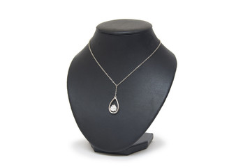 Diamond necklace on black mannequin isolated on white background