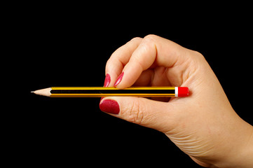 Female hand holding pencil isolated