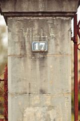 А pillar in a village with number on it