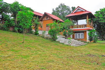 Bungalow in the floral garden by Thai northern style