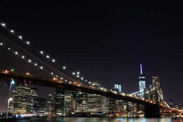 Fototapeta na wymiar Brooklyn Bridge and Manhattan Skyline At Night, New York City