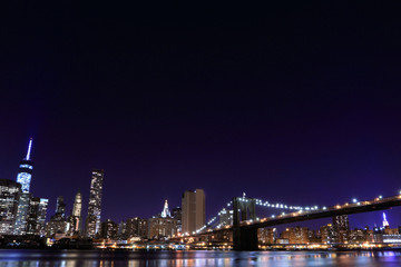 Naklejka na ściany i meble Brooklyn Bridge and Manhattan Skyline At Night, New York City