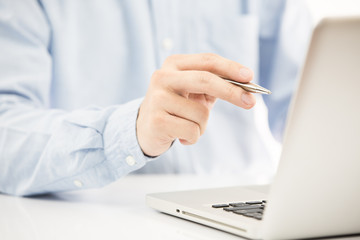Close-up of Businessman using laptop