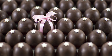 Round chocolate candies with the chosen one