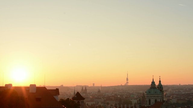 Sunrise over Prague - roofs of urban buildings