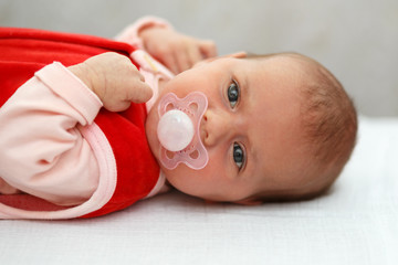 baby in red dress