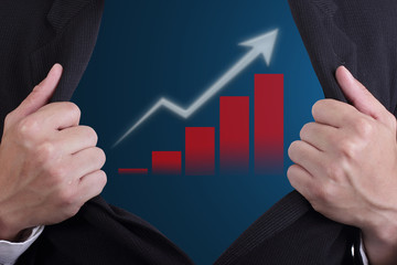 Businessman open suit to show growing graph