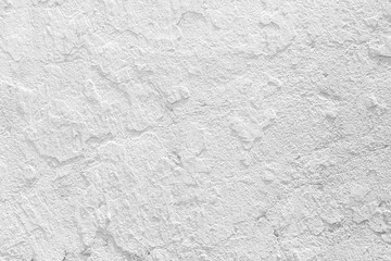 Closeup grunge texture white paint cement wall.