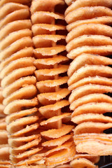 snack made from fried potato with seasoning.