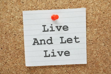 The phrase Live and Let Live on a cork notice board