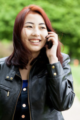 Mongolian girl talking on phone