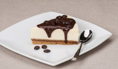Cheese Cake With Chocolate Sauce On White Plate