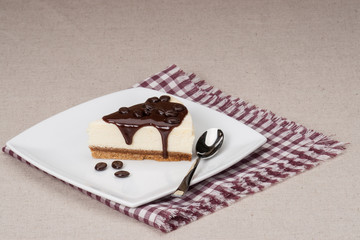 Cheese Cake With Chocolate Sauce On White Plate