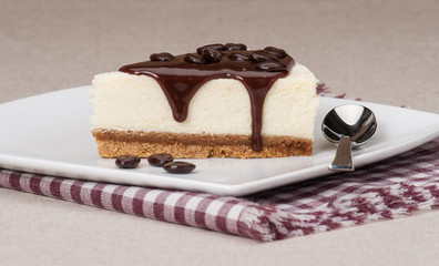 Cheese Cake With Chocolate Sauce On White Plate