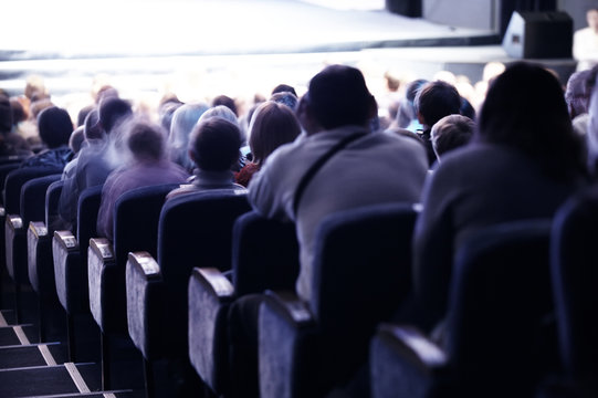 Audience Sitting In Tiered Seating