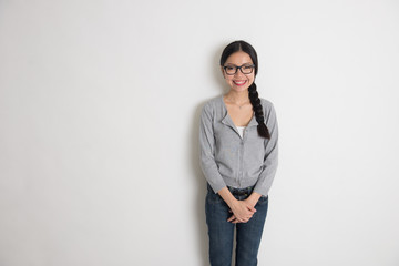 asian young female student smiling with plain background