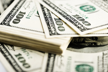 Stack of one hundred dollar bills close-up. (shallow DOF)