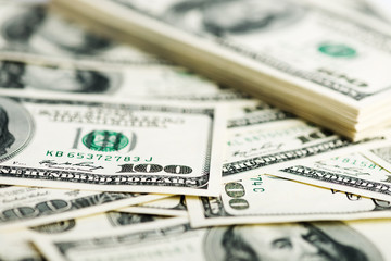 Stack of one hundred dollar bills close-up. (shallow DOF)