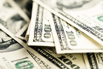 Stack of one hundred dollar bills close-up. (shallow DOF)