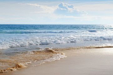 seascape, sand beach and blue sky