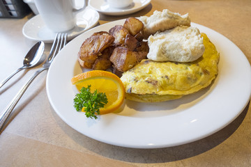Omelete Served with Biscuit and Roasted Potatoes
