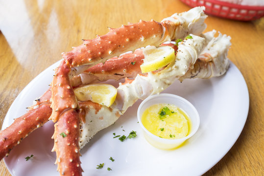 King Crab Legs Served with Butter and Lemon Slices