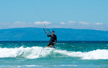 Kite surfing on a pristine beach