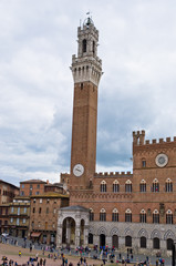 Fototapeta premium Clock tower of a city hall on main square in Siena