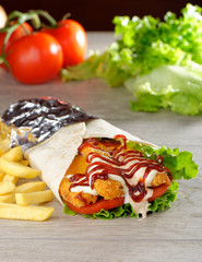 Tortilla with Chicken nuggets, french fries and vegetables