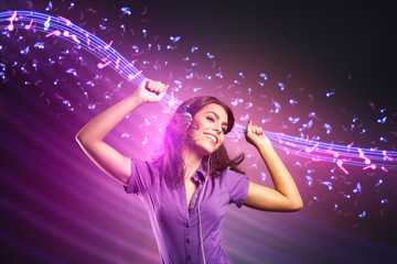 young girl dancing and listening music