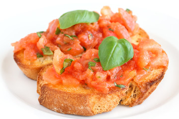 Classic italian bruschetta with tomato and basil on bread